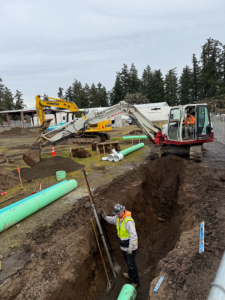 Workers install the storm drain system.